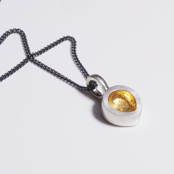 Rounded teardrop pendant with gold