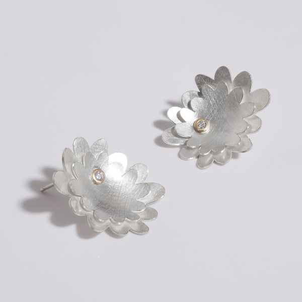 Sterling silver double layered flower studs with diamonds set in gold