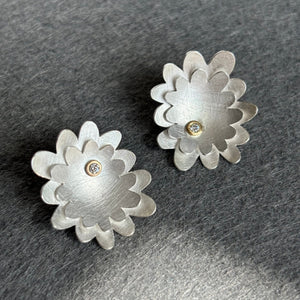 Sterling silver double layered flower studs with diamonds set in gold