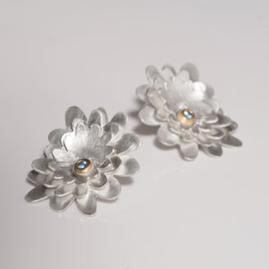 Layered sterling silver flower earring with topaz set in gold