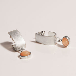 sterling silver curved huggie earrings with peach moonstone drop